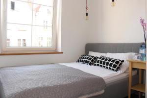 Posteľ alebo postele v izbe v ubytovaní Apartament Targ Rybny LUXON Gdansk