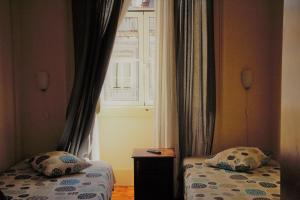 Katil atau katil-katil dalam bilik di Pouso Dos Anjos