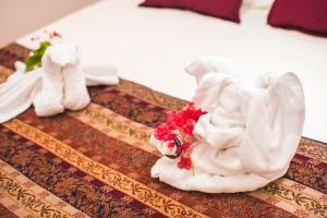 En eller flere senge i et værelse på CT Vila Raiza Goulão