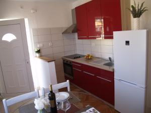 Kuchyň nebo kuchyňský kout v ubytování Apartment Vito