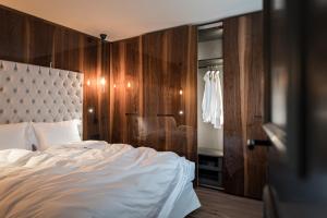 Ένα ή περισσότερα κρεβάτια σε δωμάτιο στο Messnerhaus Suite