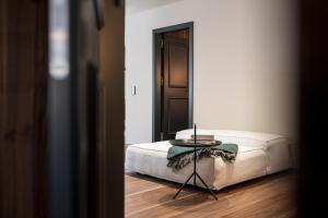 Ένα ή περισσότερα κρεβάτια σε δωμάτιο στο Messnerhaus Suite