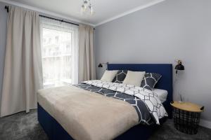 Posteľ alebo postele v izbe v ubytovaní Short Stay Apartments