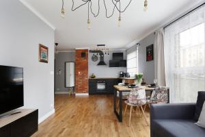 Televízia a/alebo spoločenská miestnosť v ubytovaní Short Stay Apartments