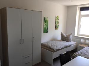 Postel nebo postele na pokoji v ubytování Leipzig-in