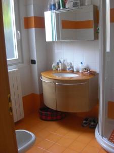 a bathroom with a sink and a mirror at Barbara's House - Liguria in Santo Stefano al Mare