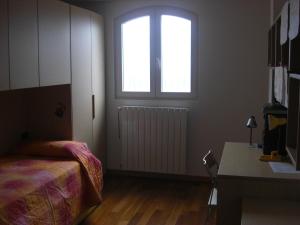 Säng eller sängar i ett rum på Barbara's House - Liguria