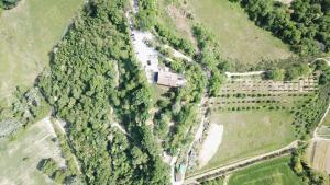 an aerial view of a house in the middle of a forest at Agriturismo Biologico Villa Rosa in Monte Guiduccio