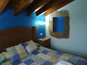 Postel nebo postele na pokoji v ubytování Casa La Pumarada