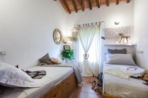 Postel nebo postele na pokoji v ubytování Le case di Lisetta Holiday homes