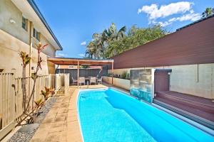 a swimming pool in the backyard of a house at 143 Matthew Flinders Drive, Port Macquarie in Port Macquarie