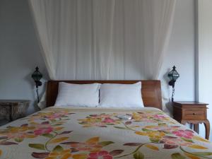 Postel nebo postele na pokoji v ubytování Ogek Home Stay