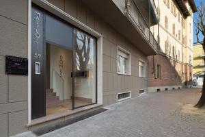 a store window on the side of a building at Suite Vogue Stazione in Voghera