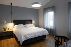 Postel nebo postele na pokoji v ubytování Zoltners Hotel