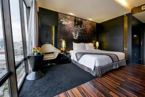 Voodi või voodid majutusasutuse Horizon Hotel toas