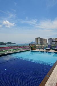 a large swimming pool on top of a building at Horizon Hotel in Kota Kinabalu