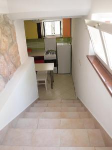 Kuchyň nebo kuchyňský kout v ubytování Apartments & Room Masa