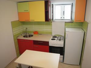 Kuchyň nebo kuchyňský kout v ubytování Apartments & Room Masa