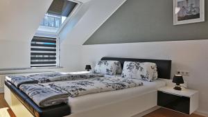 Ένα ή περισσότερα κρεβάτια σε δωμάτιο στο Outlet ApartmentS Metzingen