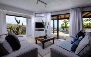 a living room with two couches and a table at Villa Thea in Peyia