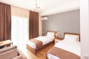 Postel nebo postele na pokoji v ubytování Hotel Amser