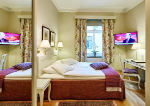 Katil atau katil-katil dalam bilik di Hotel Royal