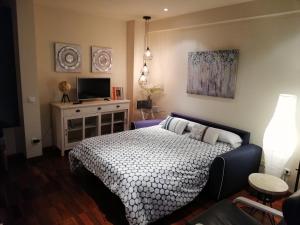 Postel nebo postele na pokoji v ubytování Apartamentos Nuncio Viejo