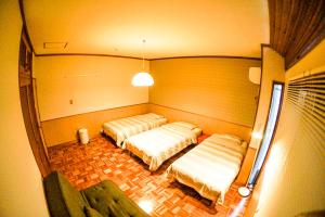 Voodi või voodid majutusasutuse Endless Summer Okinawa South toas