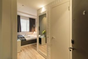 Postel nebo postele na pokoji v ubytování Belgrade Inn Garni Hotel