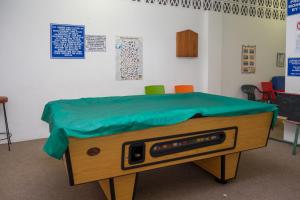 a bed with a green blanket on top of it at Seabrook 506 Margate RSA in Margate