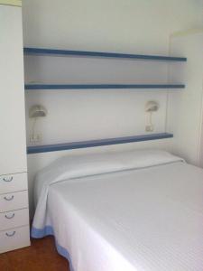 Postel nebo postele na pokoji v ubytování B&B da AnnaMaria