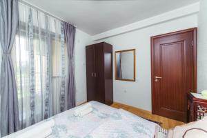 Postel nebo postele na pokoji v ubytování Villa Jadran Apartments