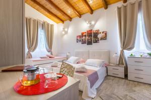 A bed or beds in a room at VILLA GIUMMARITO B&B