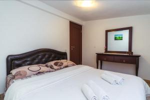Postel nebo postele na pokoji v ubytování Villa Jadran Apartments