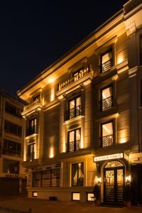 a building lit up at night with lights at Primero Hotel in Istanbul