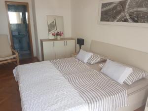 Postel nebo postele na pokoji v ubytování Apartments Podbarje