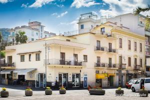 a large white building on a city street at Hotel Nice in Sorrento