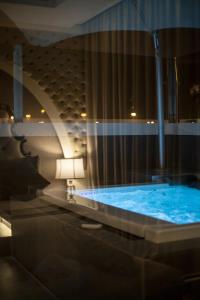 a large blue tub in a room at Aswar Qurtubah Serviced Apartments Riyadh in Riyadh