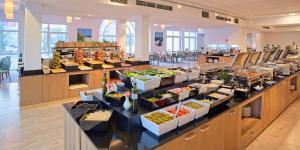 a buffet line with many different types of food at Grand Lubicz Uzdrowisko Ustka in Ustka
