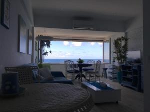 a living room with a view of the ocean at Sun & Sea 512 in Sesimbra