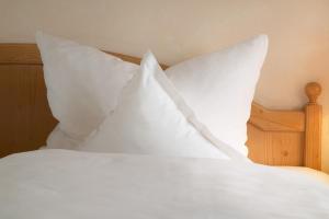 Postel nebo postele na pokoji v ubytování Hotel Mehl