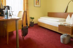 Postel nebo postele na pokoji v ubytování Hotel Mehl