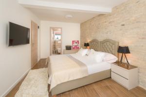 Ένα ή περισσότερα κρεβάτια σε δωμάτιο στο Agava Lux Rooms&Pool