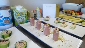 a table topped with plates of food with appetizers at MaisonMe Boutique Hotel in Bardolino