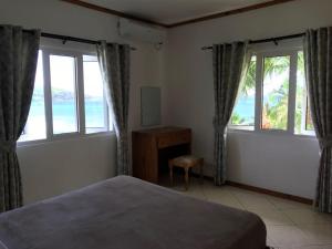 Letto o letti in una camera di Sailfish Beach Villas
