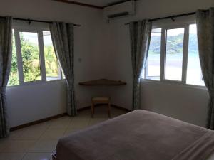 Letto o letti in una camera di Sailfish Beach Villas