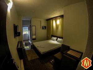 Postel nebo postele na pokoji v ubytování Hotel Millenium2