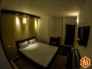 Postel nebo postele na pokoji v ubytování Hotel Millenium2
