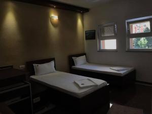 Postel nebo postele na pokoji v ubytování Hotel Millenium2