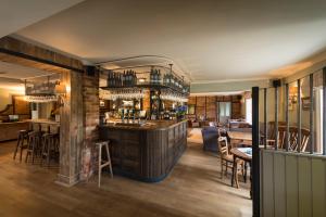 a bar in a room with chairs and a table at The Hawk Inn in Andover +33 photos